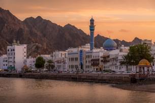 Catch stunning sunset views over Muscat's historic waterfront