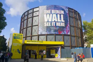 Enter Asisi Panorama: Die Mauer by entering the specially manufactured rotunda on the site of this famous Checkpoint Charlie