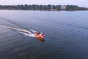Enjoy breathtaking views of the surrounding hills while on the speedboat